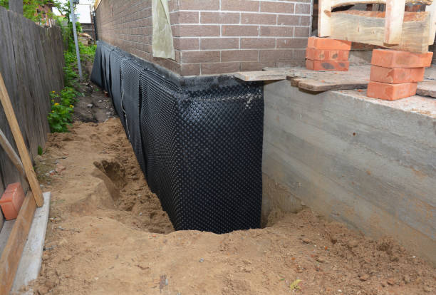 SJ Waterproofing Pros technician performing targeted Exterior Waterproofing assessment in Fletcher, OH